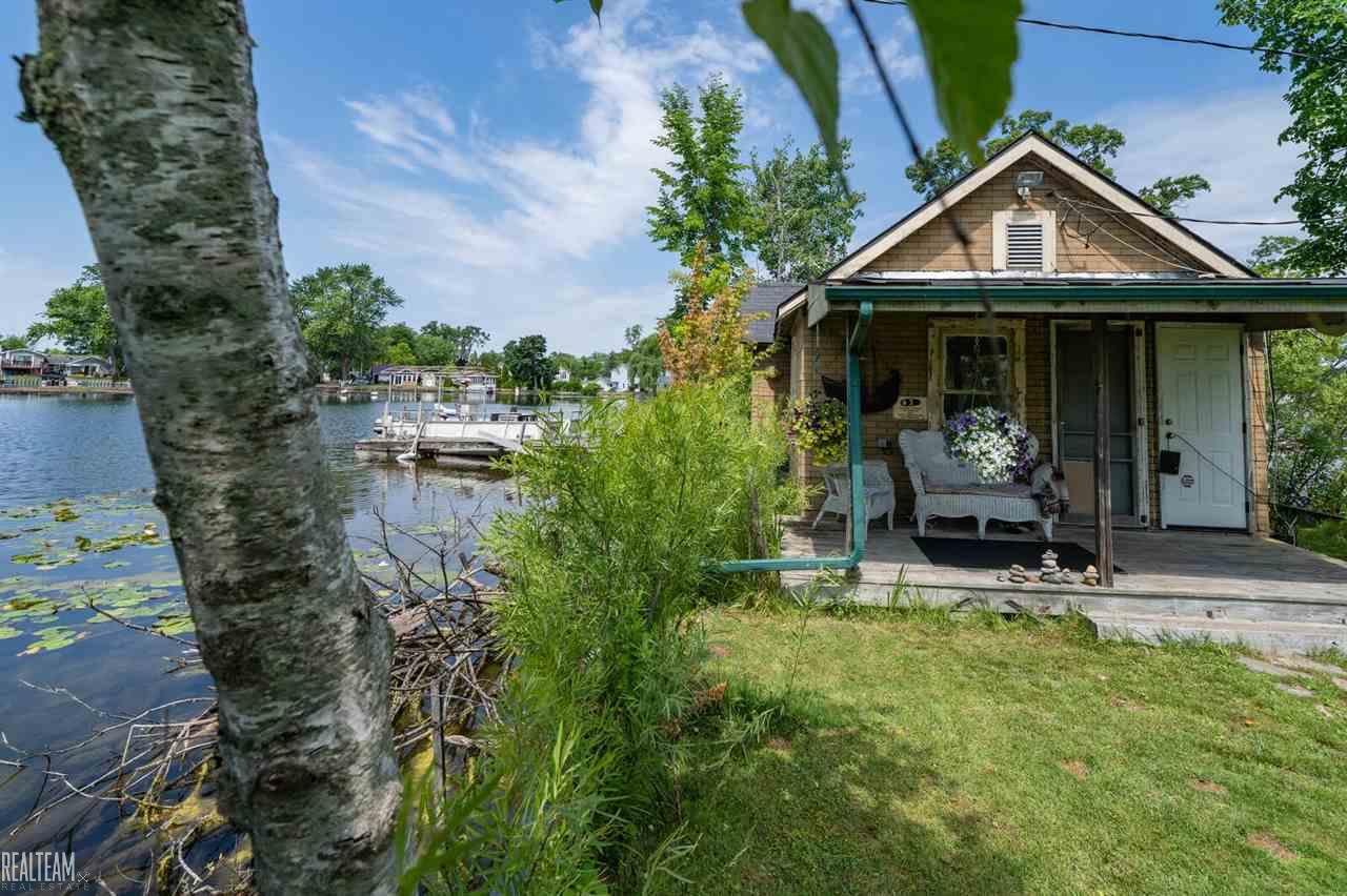 Living is easy on your own private island! This home is 1 bed and 1 full bath and sits on 1.36 acres with tons of different plants and wildlife! Situated on Pontiac Lake where you can enjoy your days cruising around the water! The sale includes lots 12-13-156-004 & 12-13-156-006!