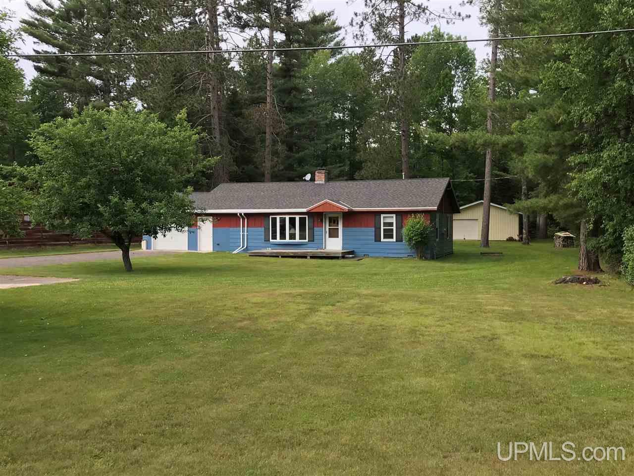 This recently updated 3 bedroom home sits nicely nestled among some large pines.  Home features, newer windows, large living room with a wood fireplace insert and nice pole barn in the back yard.  Minutes to Florence and located on the snowmobile and ATV trail.  This would be a great home, recreational property or rental property.