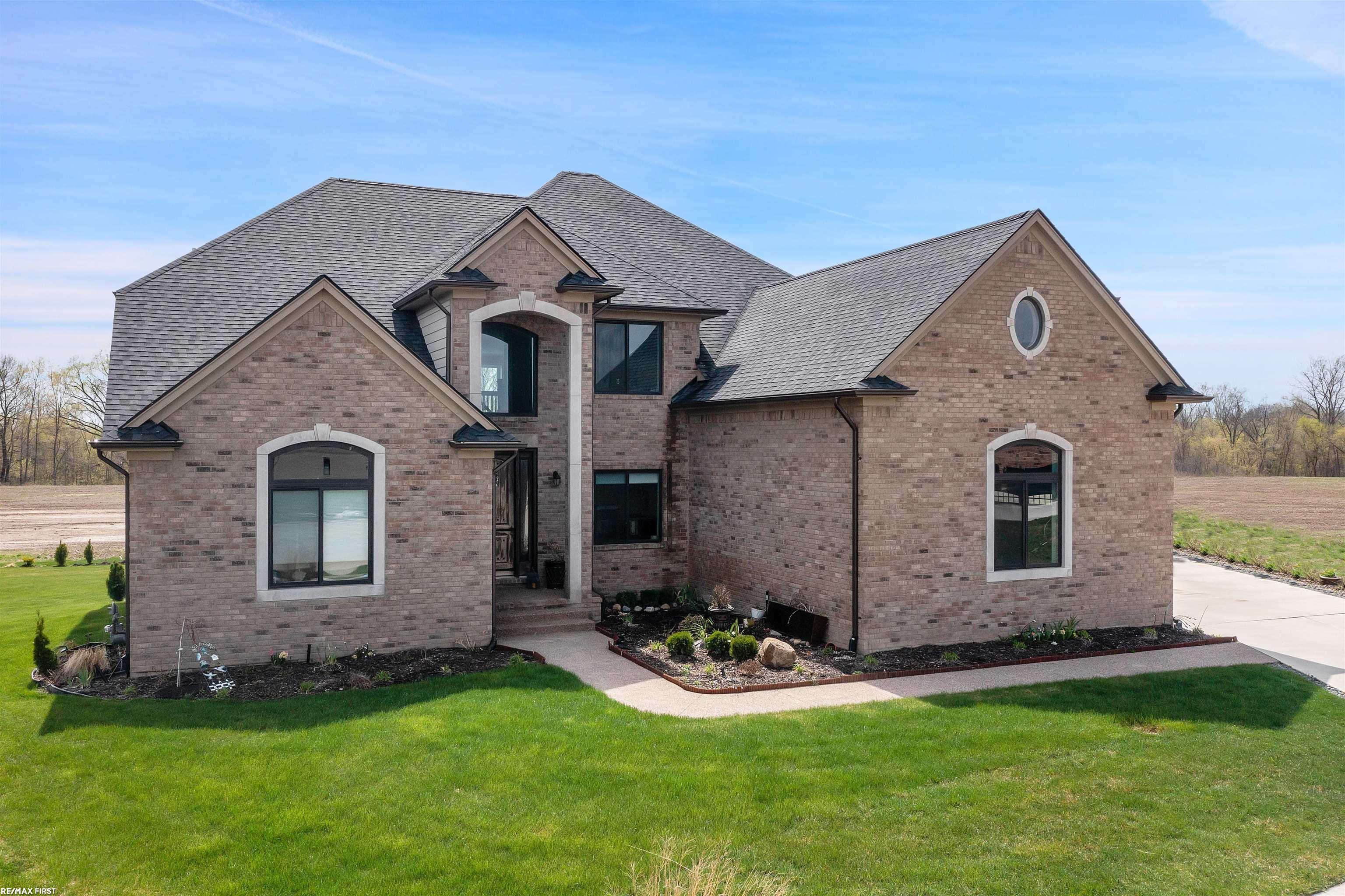 56371 Varenna Ct is a stunning, luxury home with high-end finishes throughout. The home boasts a chef's kitchen equipped with all top-of-the-line Thermador appliances, making it the perfect space for entertaining and creating culinary masterpieces. With five bedrooms, four of which feature en-suite bathrooms, this home offers plenty of room for family or guests. One of the most standout features of this home is the beautiful balcony that overlooks the surrounding landscape. There is also a covered patio, perfect for enjoying the outdoors while still remaining sheltered from the elements. In addition to these impressive features, the home also includes a custom fire pit, perfect for gathering around on cool evenings with family and friends. The attention to detail and high-end finishes throughout this property truly make it a one-of-a-kind luxury home.