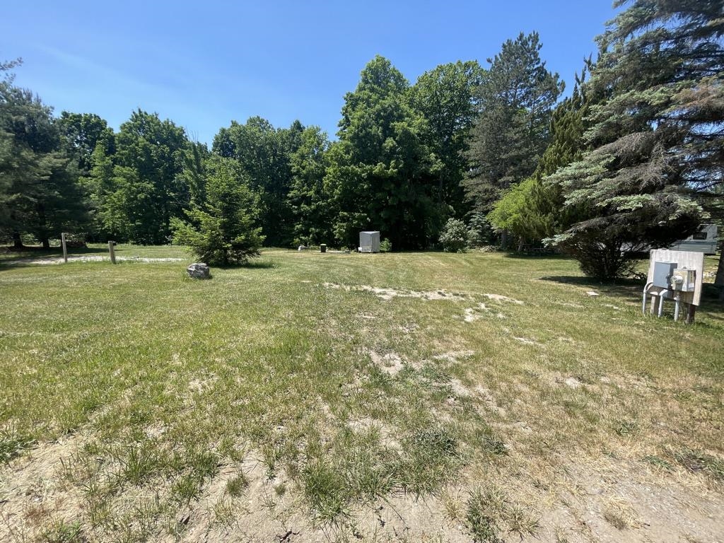 Two Contiguous lots for one yearly association fee.    Lot includes well, 3 sewer hook-ups, wide gravel drive, Electric (30, 50, 200 amp),  Small 10x10 deck, fire pit, creek at back of lot with path to creek.   Set up for 2 campers or great location for building.    Ownership includes access to 2 all sport lakes, Lake Lancer and Lake Lancelot with beach clubs for dock rental, playgrounds, pavilions and more.  Also access to 9 hole and 19 hole golf, golf simulator, heated indoor pool, and many year around activities and events.