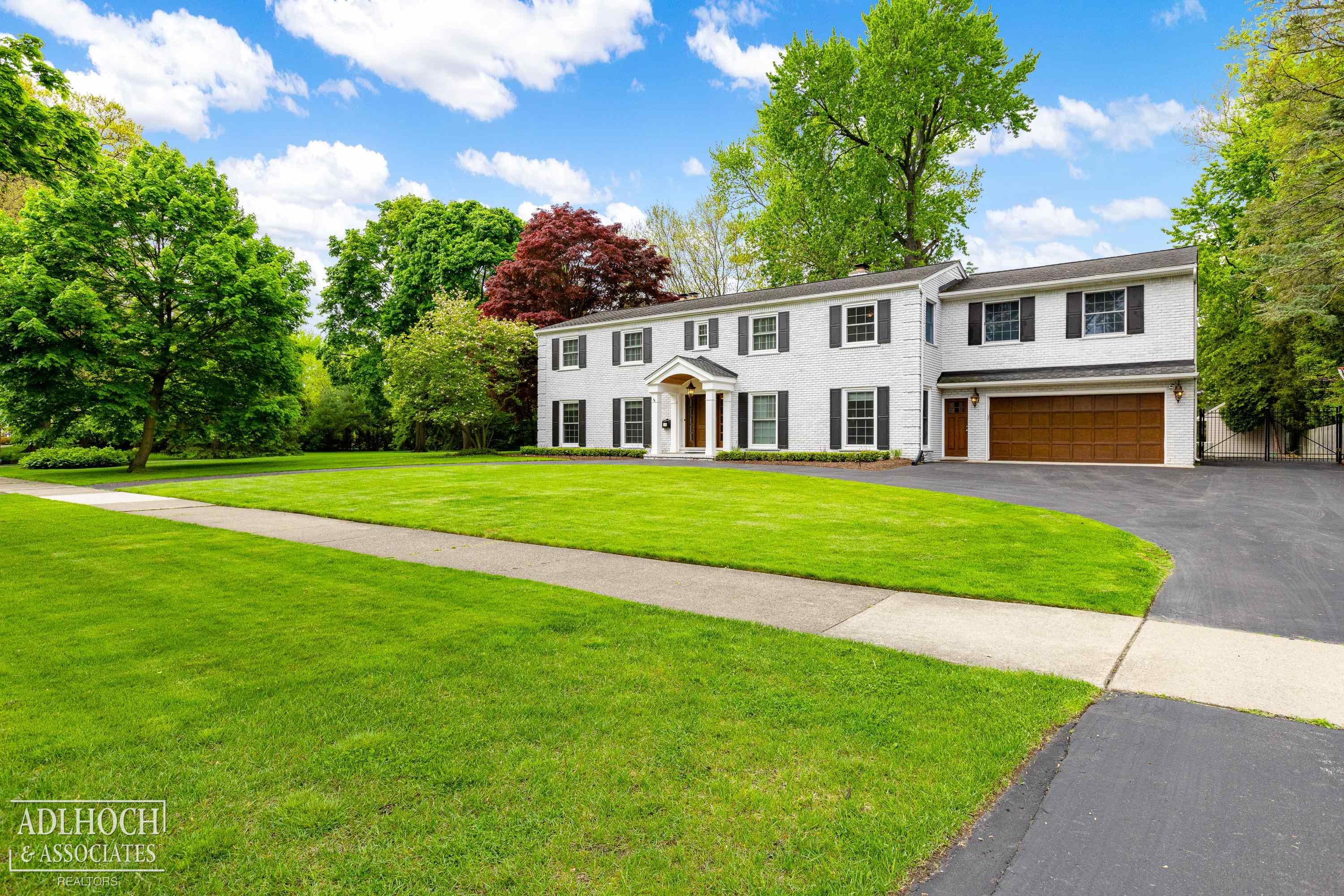 The perfect entertaining house! Meticulous sprawling 5 bed 4.1 bath classic colonial on almost an acre of land on one of the Pointe's most sought-after streets. This home features an open floor plan and a lovely chef's kitchen equipped with wolf and subzero integrated appliances. Hard to find first floor primary/in-law suite offering full living space, kitchen, laundry and heated floors throughout!  Large living room w/gas fireplace that flows into the formal dining room and kitchen enhanced by a dual gas fireplace.  Custom drapery and blinds throughout.  Cozy additional family room off the back of the house can be used as a den or office. Second floor features four large bedrooms and three full bathrooms. The primary bedroom offers a large walk-in closet and new en suite bathroom with heated floors and floating tub. Commercial-grade WIFI installed throughout. Full-house water filtration system and UV air filtration system. Updated electrical enhanced by a full-house generator. New aggregate patio, exterior paint and landscaping. Transferable warranty on newer weather guard windows, circular and extended driveway recently sealed. Heated 2.5 car garage with epoxied floors. Finished basement space perfect for a home gym including an additional half bath. This home is in pristine condition and offers a rare opportunity of a turn key property on a park-like setting steps to the lake and two resident-only parks.