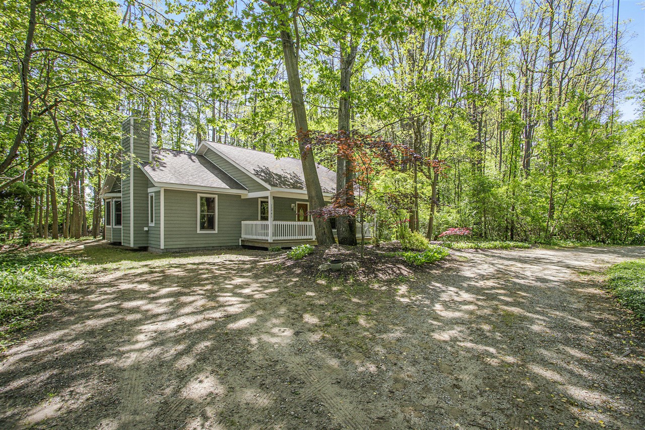 Cute classic cottage tucked in a wooded lot. 3 bedrooms and 2 full baths with a cute floor plan and all appliances. Easy to maintain home with access to Chikaming beaches! Trey ceiling in master suite. Bay window in dining room. Full front porch and deck in back. This is the way to be in Harbor Country!