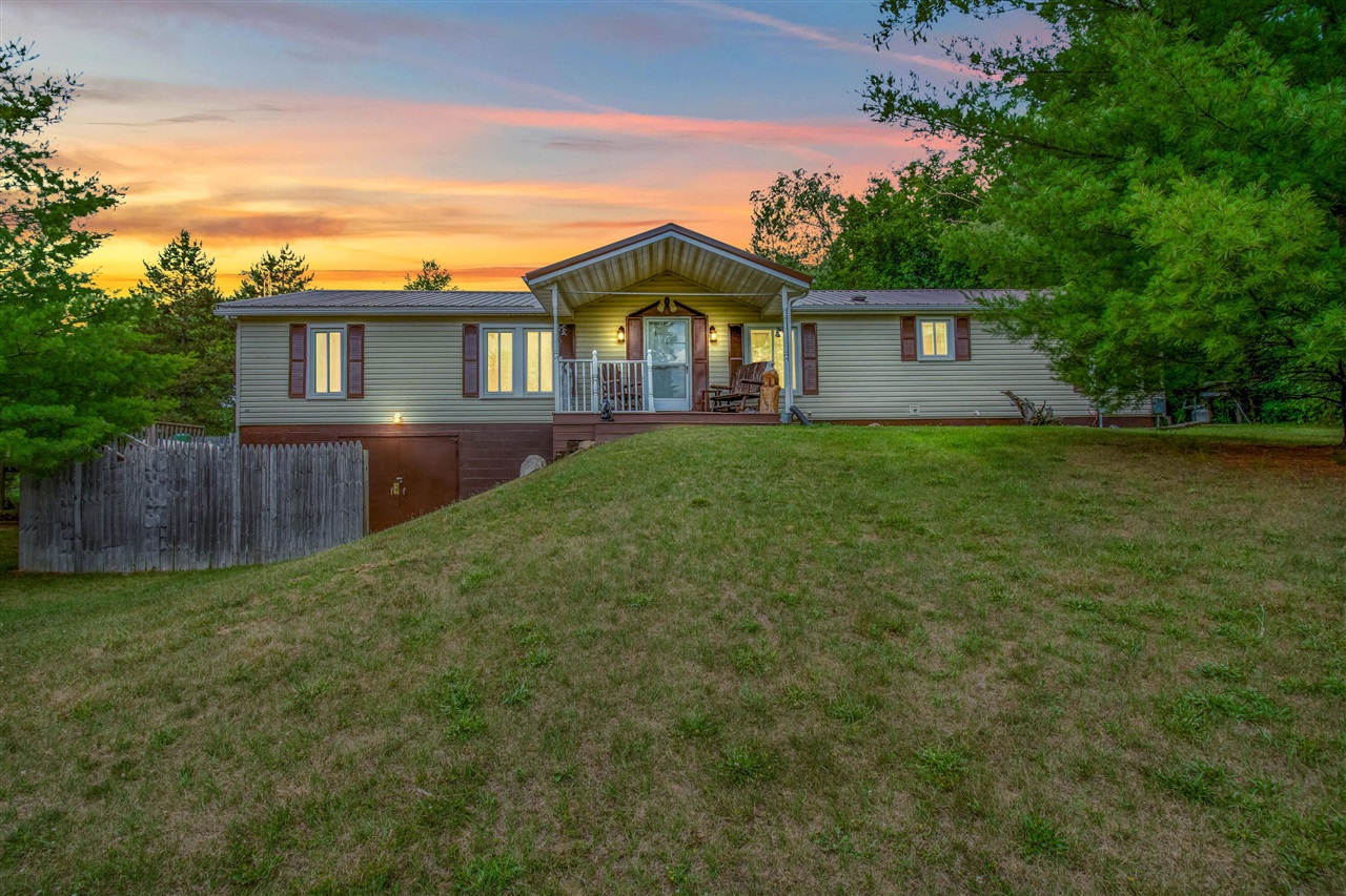 Enjoy country living in this ranch home surrounded by 6.21 acres of nature! Home features 3 bedroom, 2 full bath, living room, family room, and a full walkout basement. Gated access up the driveway and 3 large outbuildings. Both outbuildings have power and water. New steel roof 2023, new flooring 2021, and both well and septic inspected 2022. Wait till you see the 84X32 Covered greenhouse. Call today to schedule you private tour. It is the responsibility of the parties looking at the property to satisfy themselves as to accuracy of this information. Taxes were obtained from the local assessor and the taxes could change for the buyer after a closed transaction.