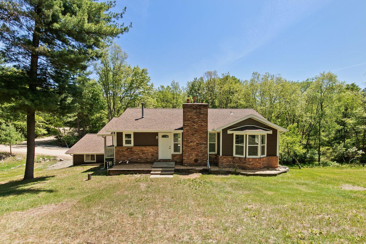 Stunning, completely renovated ranch-style home nestled in the beautiful & serene community of Canadian Lakes, MI. This 4-bedroom, 3-bathroom gem is perfect for families & investors alike, offering a fantastic layout with 2 bedrooms on the main floor & 2 bedrooms in the lower level, each with their own private bathrooms. The walk-out basement leads you to a tranquil, peaceful property surrounded by nature, providing the perfect setting for entertaining guests with a spacious deck ideal for BBQs & ample yard space. You'll love the incredible transformation both inside & out, featuring two cozy fireplaces on each level & a lower-level living area that exudes warmth & comfort. Don't miss your chance to experience all that this gorgeous property has to offer. Call to schedule your tour!