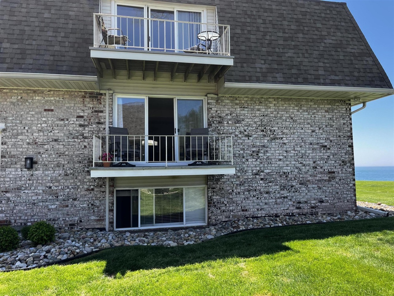 Your next vacation spot! Enjoy Lake Michigan views, lake access, and two on-site pools. Multiple community grills and tables on the bluff overlooking Lake Michigan.