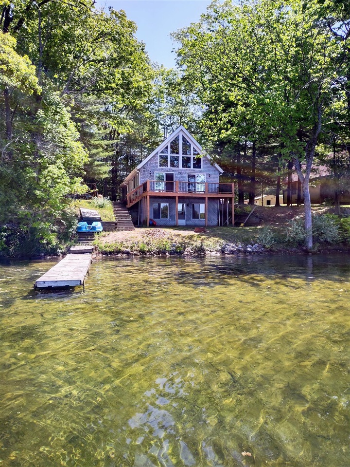 Don't miss out on the opportunity to own this spacious lake house on all sports Big Bass Lake. Stunning lake views from the home and deck, and just footsteps to the water. Extra deep 1+ acre lot for activities and extra parking for guests to stay. 30x40 pole barn, and the attached 2 stall garage offer tons of storage for lake toys. Unfinished walkout lower level offers the chance to add bedrooms and/or additional recreation area. Explore the nearby Manistee National Forest and miles of hiking, biking, ATV and snowmobile trails. This property has historical great occupancy as a AirBNB VRBO vacation rental at over $300/night. Turnkey opportunities abound for fun and/or income. Schedule a showing today to embrace your own slice of paradise