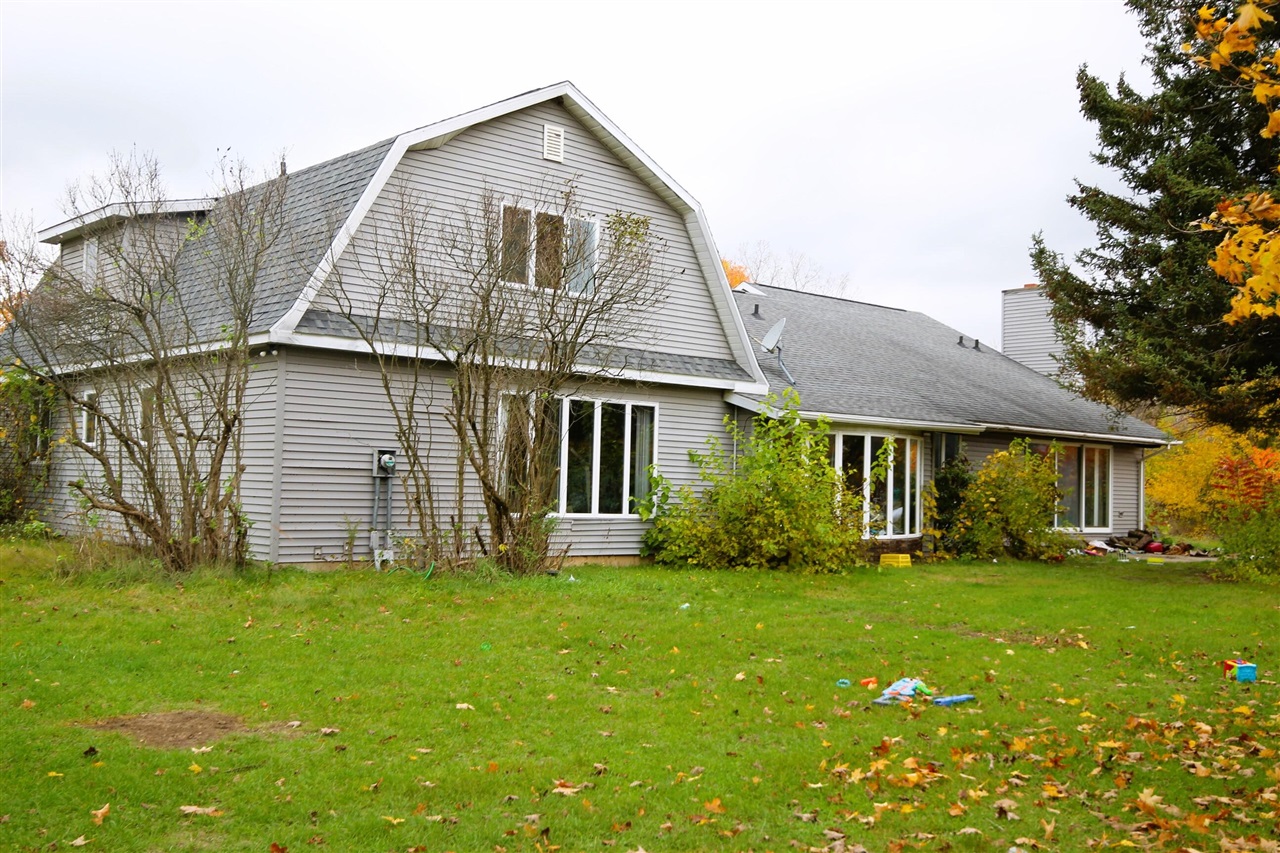 Now available for sale -- an incredible opportunity for investors with a keen eye for potential.Featuring 3 spacious bedrooms and 2.5 bathrooms, this house offers ample space for comfortable living. The large size of the property provides endless possibilities for expansion or customization. Imagine creating your dream oasis amidst lush greenery and mature trees that surround the premises, offering tranquility and privacy.Situated off the road, this residence ensures peaceful living away from the hustle and bustle of city life. The 65x45 pole barn further adds to its versatility, serving as a perfect space for storage, workshop, or even a creative studio.