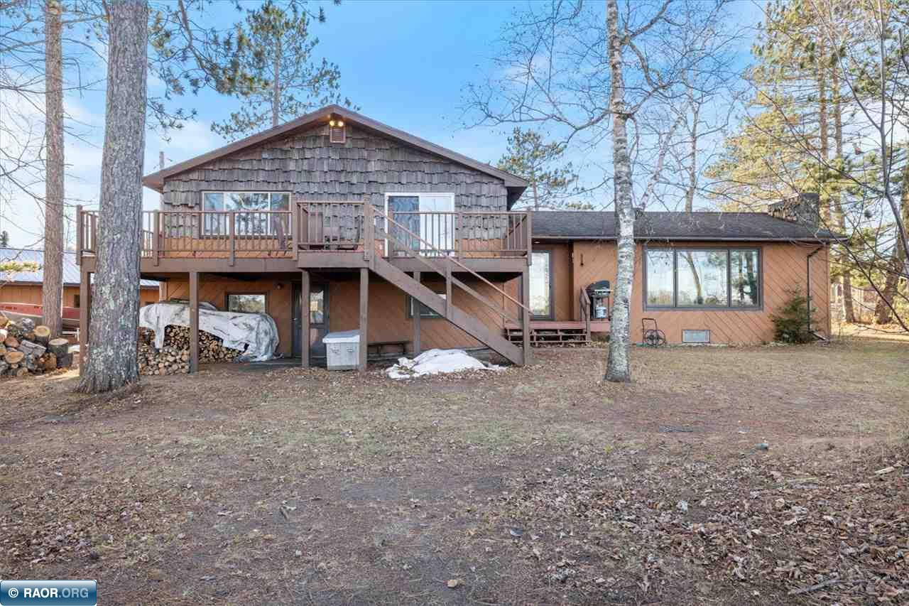 Escape to your own waterfront retreat on Sand Lake in Britt! 457 Ft of shoreline on your own point! This spacious multi-level home offers 4 bedrooms, 1.5 bathrooms, and a lower-level rec room complete with a bar—perfect for entertaining. Unwind in the large sauna with its own shower, and enjoy abundant natural light throughout the home. A large deck faces the water, ideal for soaking up the serene lake views.  The property features a sandy-bottom shoreline, private boat landing, and a protected bay for boat and dock, providing the perfect setup for all your water activities. A 3-stall detached garage, plus an additional lean-to, offers ample storage for vehicles and lake toys. Don’t miss this unique chance to own a piece of lakefront paradise!