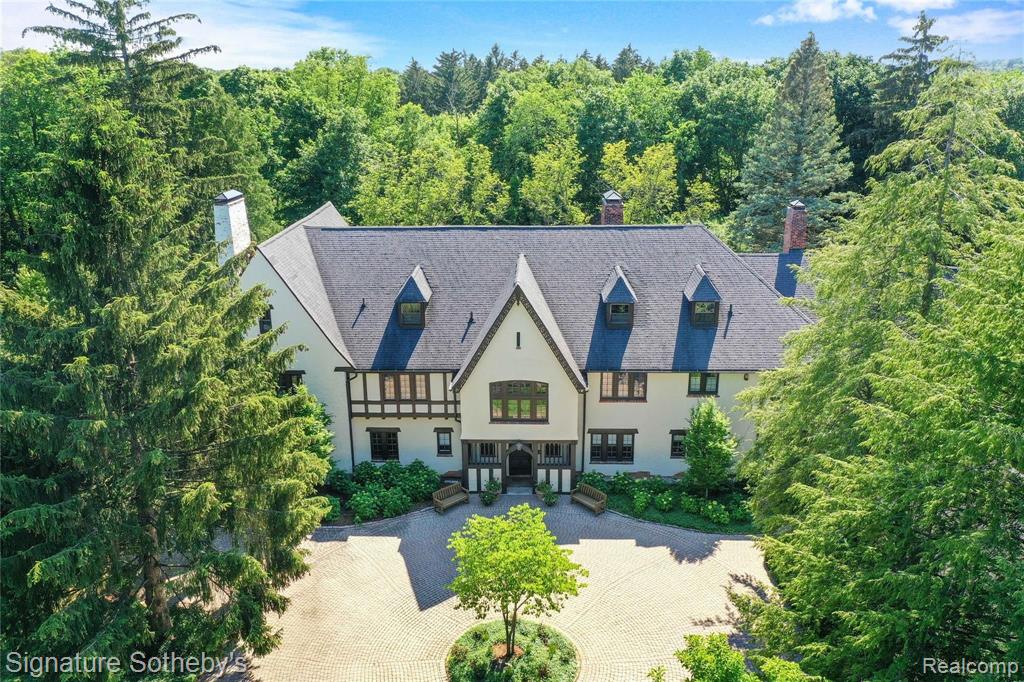 Magnificence impresses at every turn of this grand historic family home set on 2.87 lush acres w/amazing views, swimming pool & incredible outdoor living areas! Construction began in 1922 & concluded in 1924 by the son of wealthy industrialist George Hammond, this Tudor-style treasure has been impeccably updated from top to bottom & offers an endless list of refined amenities & details. Among them are exquisite formal rooms, 4 spacious suites, 4 additional bedrooms, 6.5 baths, a premium Kennebec, Maine handmade cherry chefâ€™s kitchen, butlerâ€™s walk-in pantry, master retreat, a world-class spa, screened sunroom w/fireplace, new custom exercise room, custom-built home theater with stadium seating, a hidden speakeasy, along with custom original plasterwork, original leaded glass windows, gorgeous hardwoods, a 4-car garage, state-of-the-art electrical, plumbing, energy, AV & security systems, full-house generator & much more! Youâ€™ll truly want for nothing at this Bloomfield Hills landmark.