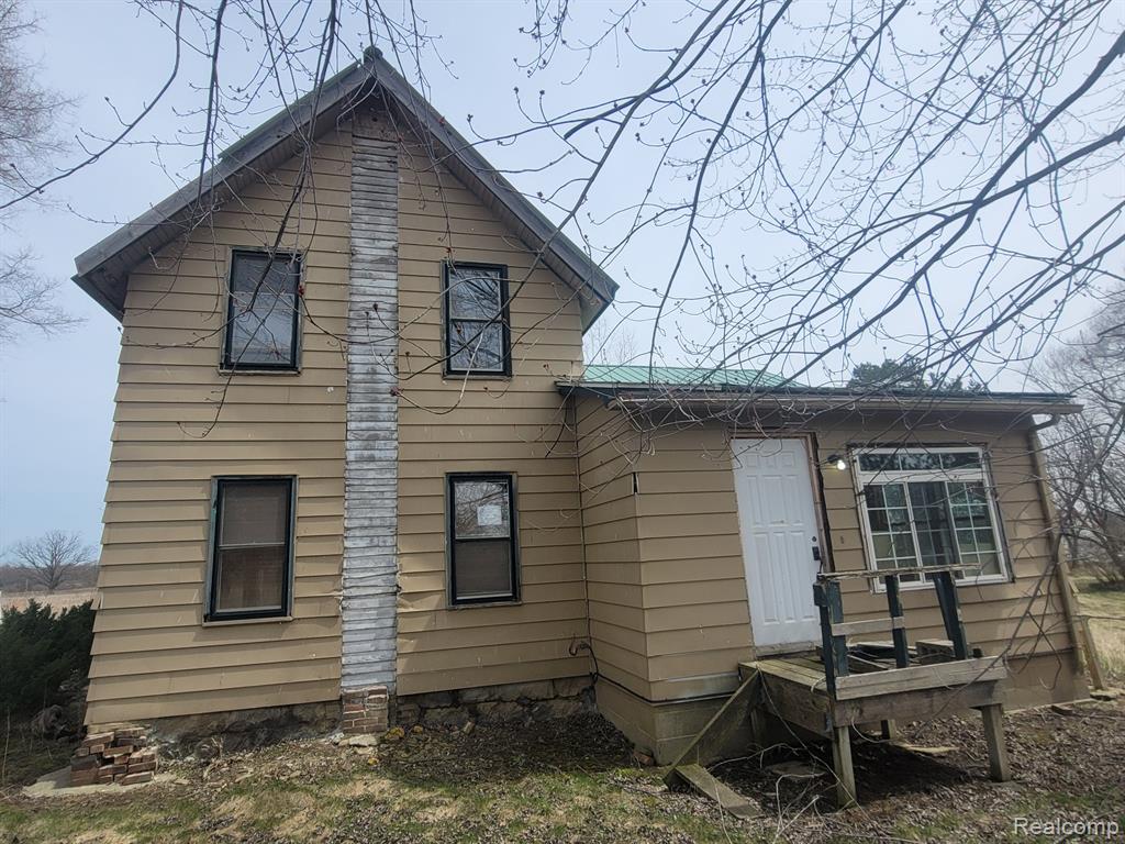 4 bedroom 2 bath farmhouse on over 5 acres with mechanics pole barn with cement floor and mechanics lift. extra sheds on property metal roof, back deck. Home is in middle of remodel and needs completion, great opportunity for the right buyer!