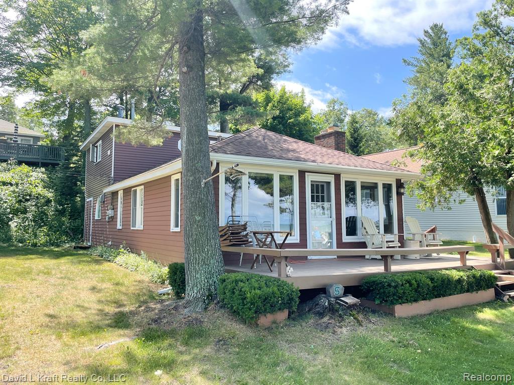 LAKE FRONT / CANAL: You have the best of both world's. Enjoy lake front living with a canal to park your boat just a 100' from the house. Walking bridge leads you to a great sandy beach. 2 bedroom, 2 bath, 1-1/2 story with crawl space & 16' x 24' detached garage. Original part of house built 1935, Dining room added 1970's, second floor above Dining room added late 1980's early 1990's. Includes 2 window AC units. Property is located in the Cass City Summer Home Club. A purchase has to be made with Cash or financing thru Bay Port State Bank. This property does not qualify for conventional financing because it is part of a Coop. Boat slip cost $30 per foot for the season if you have a boat. Annual Coop dues $1,700. Cass City Summer Club requires Buyer approval before purchase. You will receive 2 shares of stock as part of the purchase.