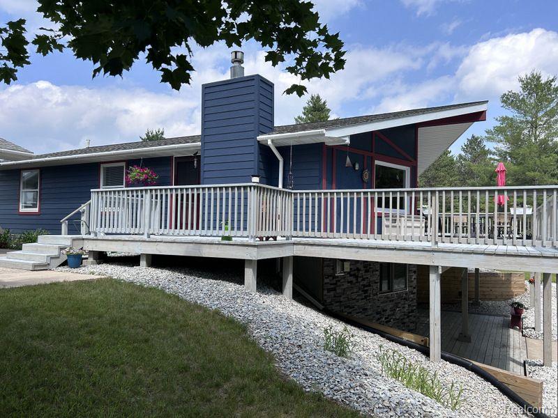 Modular home on poured concrete walkout basement. Comprehensively remodeled 2021/2022, 2000 feet of frontage on the Sturgeon River, 40 primarily wooded acres. Kitchen and bathroom all remodeled since 2021. Bertch USA hardwood cabinets in hickory, all kitchen appliances 2017 or newer. High grade laminate countertops, large kitchen island, vinyl plank flooring throughout first floor except carpet in two bedrooms, New 2023 gas water heater, gas fireplace 1St floor living room, gas log stove in basement family room, Front load washer and dryer basement utility room, whole house water conditioner/filter system, Newly refurbished basement family room with surround sound wiring, kitchenette, basement refrigerator and chest deep freezer, laundry sink, full basement bathroom with tile walk in shower, double sink vanity with hickory cabinetry, large basement bonus space with book shelving and American Security gun safe. Safe available for sale with house for 3000 dollars, all basement floors are vinyl plank, professionally installed monitored alarm system, Ring cameras and door bell, wood deck refurbished 2022, wireless weather station with wireless sensors, extra deep and wide 3 bay garage with door openers and work bench, Roll up door tool shed, extra long boat shed for canoes and kayaks. Home foundation is externally insulated with closed cell foam below grade, above grade foundation sided with architectural concrete block panels 2021, interior basement walls spray foam insulated including all floor joist pockets, dual 1000 gallon septic tanks with separate drain fields. Basement drain field new 2022, House resided with LP Smart siding including all new Tyvak vapor barrier wrap 2021. Recently improved exterior landscaping including gravel driveway extension to backyard, custom steel fire ring with washed sand surrounding. Owner available for questions and explanations. Wall mounted televisions on main floor and basement included in price. Household furnishings negotiable w