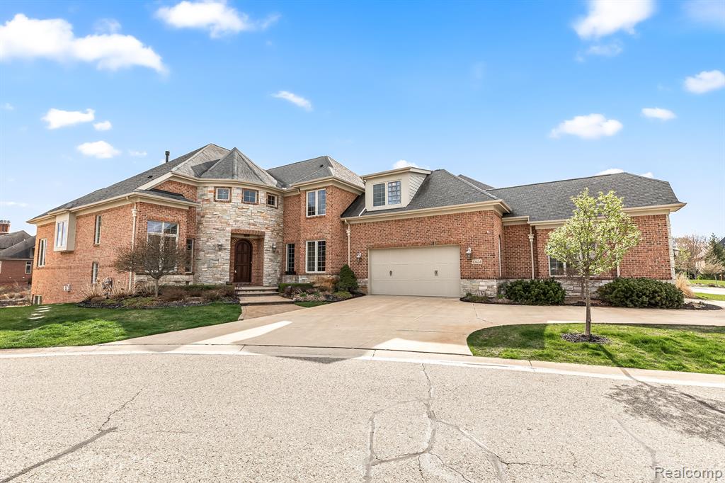 OPEN HOUSE SATURDAY 1-3 PM. Step into luxury with your very own custom waterfront oasis located in the prestigious Hidden Lake community. You will love the custom moldings, uplighting, stunning hardwood floors, plush luxury carpeting, and travertine tile throughout this home. The gourmet kitchen is a chef's paradise, featuring stainless steel appliances, meticulously crafted custom maple cabinets, a tile backsplash, granite countertops, and an eat in kitchen with picturesque views of the serene lake. Indulge in ultimate relaxation in the tranquil 4 seasons sunroom, complete with a cozy fireplace that exudes warmth and comfort. The second floor offers a luxurious primary suite, with a private balcony that overlooks the tranquil waters below, and a spa-like ensuite with garden tub, walk-in shower, and a dressing area. Two additional bedrooms, each with their own private full bathrooms and walk-in closets and a multi-purpose loft space completes the second floor. Entertain in style in the finished walkout lower level, featuring a full bar, spacious family room, additional bedroom, and full bathroom. Step outside and bask in the captivating ambiance of the covered patio, perfect for socializing and making unforgettable memories. Finally, revel in the stunning views from your private sandy beach and custom dock with water and electricity. This custom waterfront home is truly a masterpiece of unparalleled beauty and elegance. Enjoy neighborhood walking trails, music at the amphitheater or get together with neighbors at one of the many Hidden Lake social events or family gatherings. Also for sale, see MLS # 20230028615.