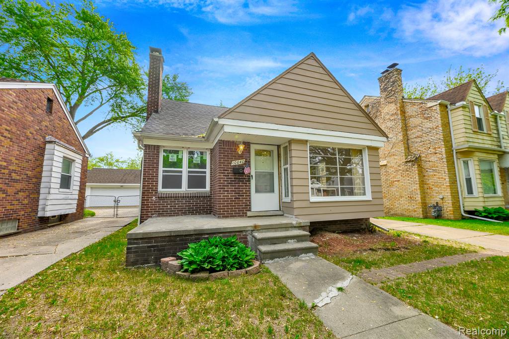 Gorgeous Updated Brick Bungalow featuring 3 bedrooms, large living room with a natural fireplace, formal dining room, remodeled kitchen and bathroom, new windows, refinished hardwood floors throughout, sunroom, and a basement. Conveniently located near shopping, highways and 20 minutes from Downtown Detroit.