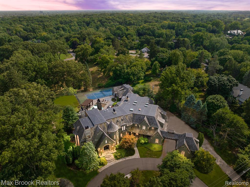 Take this opportunity to move into one of the finest properties in Oakland County. Designed for year around entertainment, this magnificent estate has it all! Natural light flows throughout as you walk into the two-story grand foyer and great room. A formal first floor office off the foyer features a second story conference area with half bath, ideal for the work at home environment . The Chef inspired kitchen with Wolf & Miele appliances, custom cabinetry, dual prep islands, one w/ seating, opens to a large gathering space with access to a screened in porch with fireplace. The first floor was also designed with a study workspace and mud room, one like youâ€™ve never seen. All bedroom suites are upstairs. The Owner's wing highlights a separate sitting area, balcony overlooking the spectacular pool & grounds, a luxurious ensuite with floor to ceiling seated shower, sunken tub, & has two oversized walk-in closets, ancillary office space, morning bar, exercise room and more. The finished lower level is complete with an indoor basketball court, wrap around bar with 2nd kitchen, rec room and theater room. Relax or entertain outdoors with multiple dining areas surrounding professional hardscape which encompasses an oversized pool that looks over a tennis court and the private grounds. The pool house is complete with a full kitchen and guest quarters. Additional features: ample storage throughout, multiple fireplaces, indoor/outdoor hot tub, exterior pickle court, 6 car garage, & so much more. This special home is a rare find, filled with every amenity and a must see!