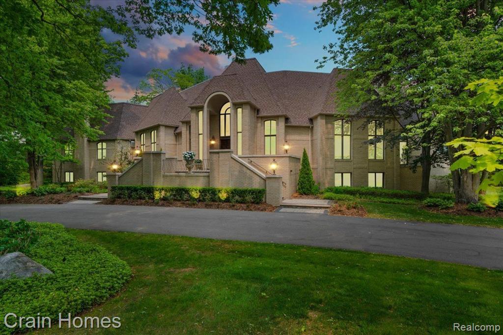 Spectacular custom built home, located on a highly desirable Bloomfield Hills street, sitting on 1 acre, features 5 spacious bedrooms, 7 baths, and a 3 car garage through out the 12,518 SF of finished living area. Throughout the house you will find high ceilings and hardwood floors with an extensive culinary kitchen with top of line appliances and a formal dining room perfect for hosting large dinner functions. This home has plenty of functional spaces from the formal living to the backyard walkout, with well manicured gardens, and an abundance of natural light throughout. 1st floor large primary bedroom with separate closets and spacious bathroom. Finished lower level including wine cellar, wet bar, theater room, and home gym with an in-laws suite. From the gold leaf in-layed ceiling in the dining room to the wood paneled library with custom shelving, to the entertainers paradise in the lower level, the details in this home make it a must see.