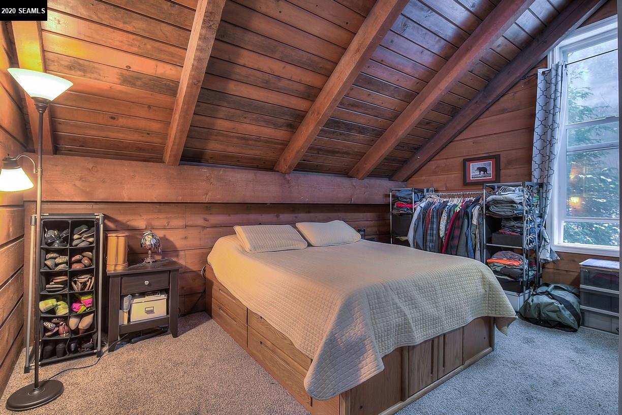Located upstairs the master bedroom has two closet areas, vaulted ceilings.