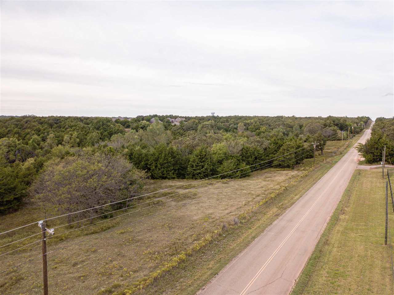 Location, location, location. This fantastic 32.17 acres now available with endless possibilities for this piece of land and pave road access in SW Stillwater. Whether you want to build, have a place for cattle/horses or just enjoy having land, do not miss your opportunity. This property is located on S Country Club Road, between 44th and 56th, south of Red Rose Valley. Stillwater Schools District. The property has already been surveyed with pins set. The land is a combination of pasture land and trees. 5 strand fencing on majority of property. Utilities are along Country Club Road. Call for your private showing today!