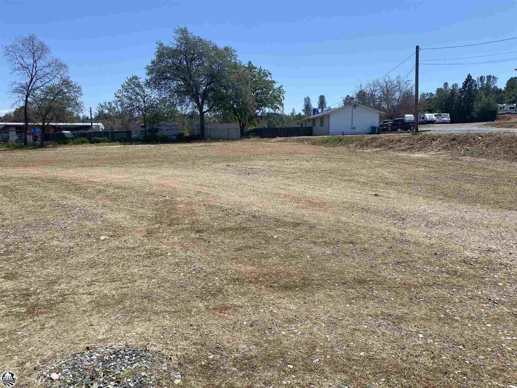 Prime commercial (zoned M-1) lot with visibility from Highway 108 in Soulsbyville!  This parcel is nearly 3/4 of an acre, flat, and ready for your plans!  District water, sewer, and three phase power are along the property.  All that is missing is you and your business!