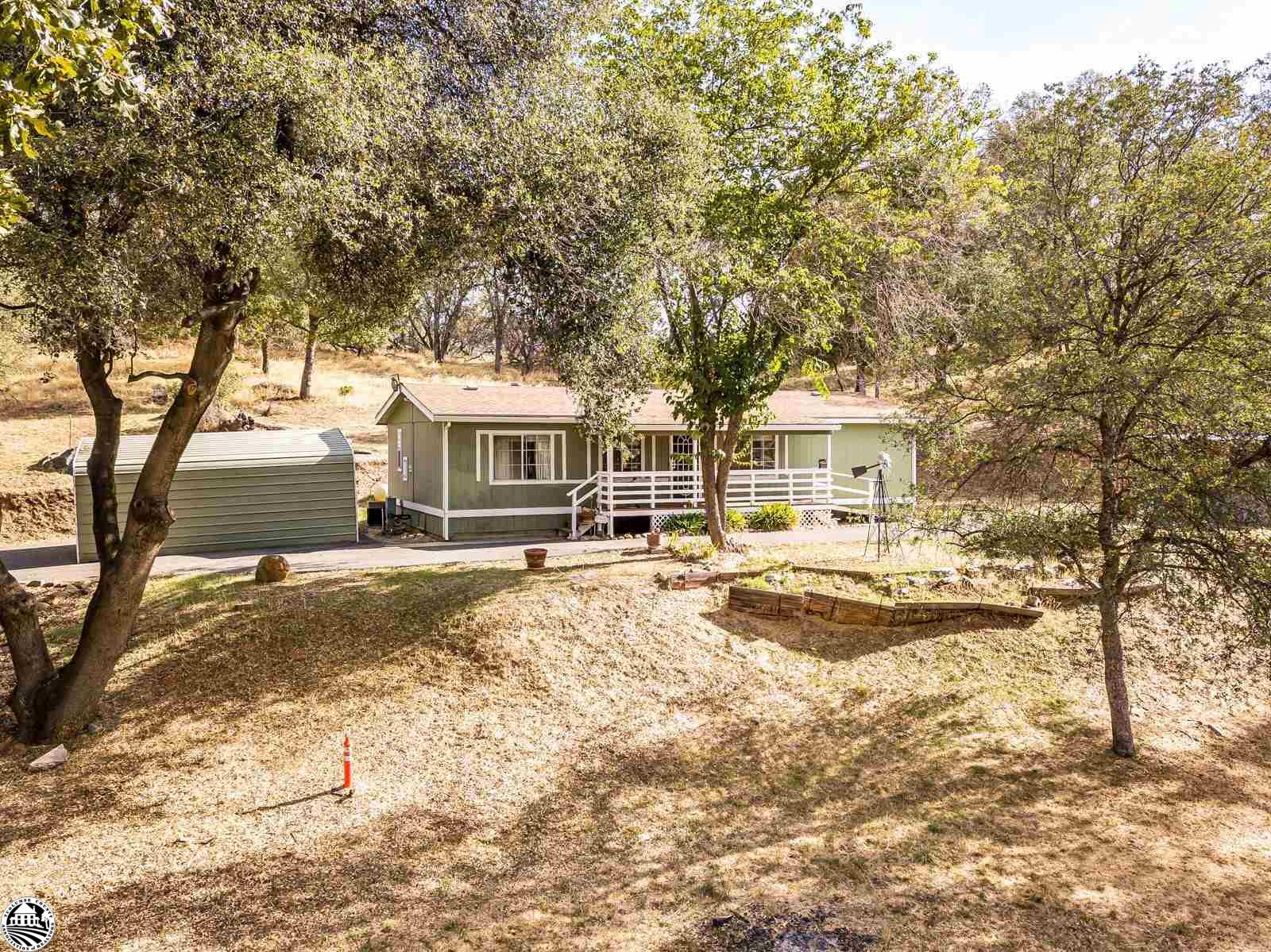 Here is your chance to own your own Sierra Foothill Ranchette with 2 acres! There is a nice detached shop, level parking and a paved RV parking pad. There is even a ramp for access if needed! The location is nice as you are close to shopping, Sonora, Twain Harte and Black Oak Casino.  It's just a short drive to Yosemite National Park, the Sonora Pass, Pinecrest and Dodge Ridge Ski Resort.  You can have Dish for Internet and TV.  This could also be a great property for those 4-H projects!  There is a third room that can be an office or a sleeping room as it does have a closet!