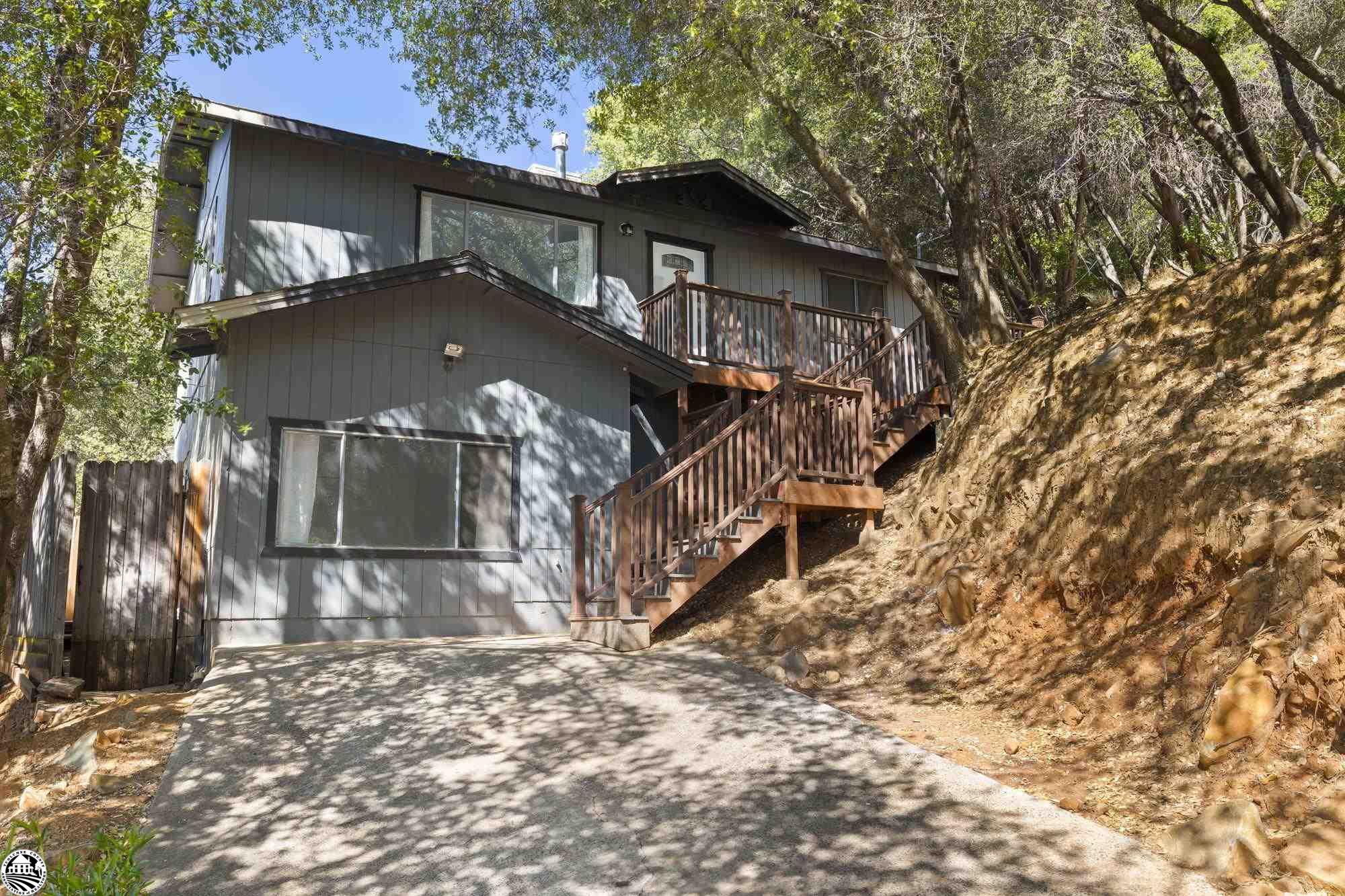 **Seller states they are not a part of the CA. Fair Plan and insurance is $1200** currently, buyer to verify**  Quiet, hillside home in Meyers Hill that has been UPDATED!!!!!!!!  All you need to do is move into this sweet little 3/2 and start enjoying living downtown Sonora. On the main level you will find the kitchen, family room, two bedrooms and a full bath.  Downstairs is the primary bedroom with bathroom and inside laundry There is plenty of outdoor space to enjoy the four seasons of Tuolumne County