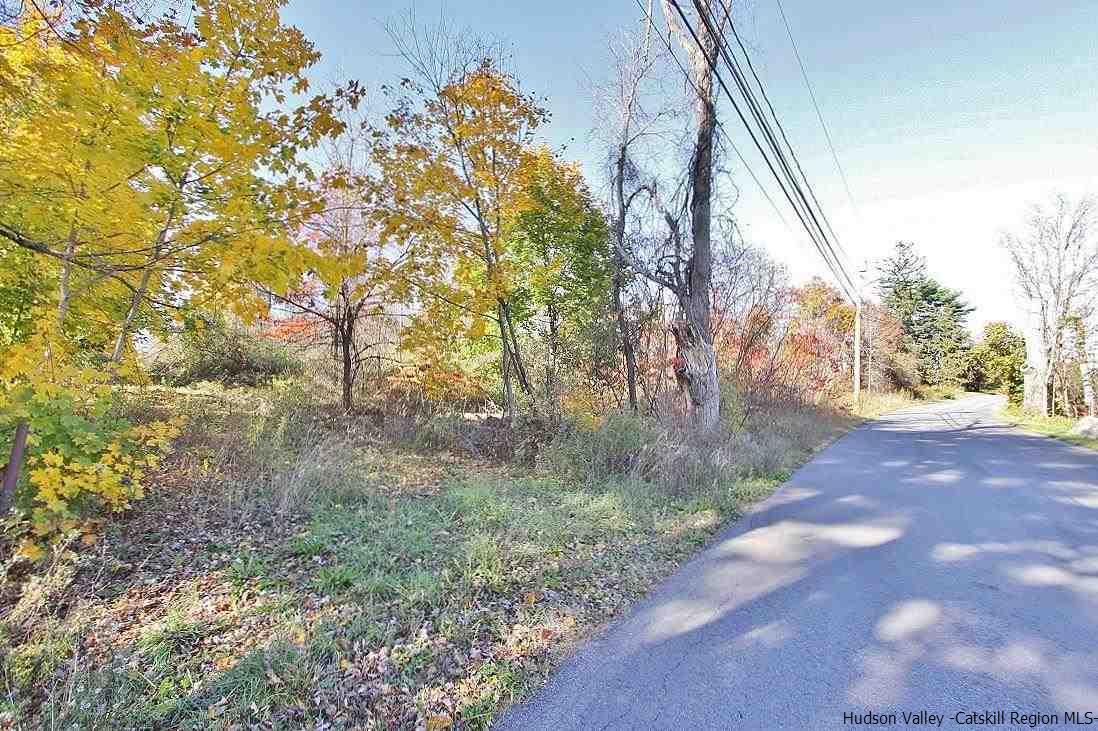 Commercial land located off a rural road and close to the NYS Thruway Exit 18 New Paltz.  The front part of the land may be best suitable for a residential home (but would need a a variance).  The back portion of the land adjoins another vacant parcel of +/- 28 acres that the seller also owns.